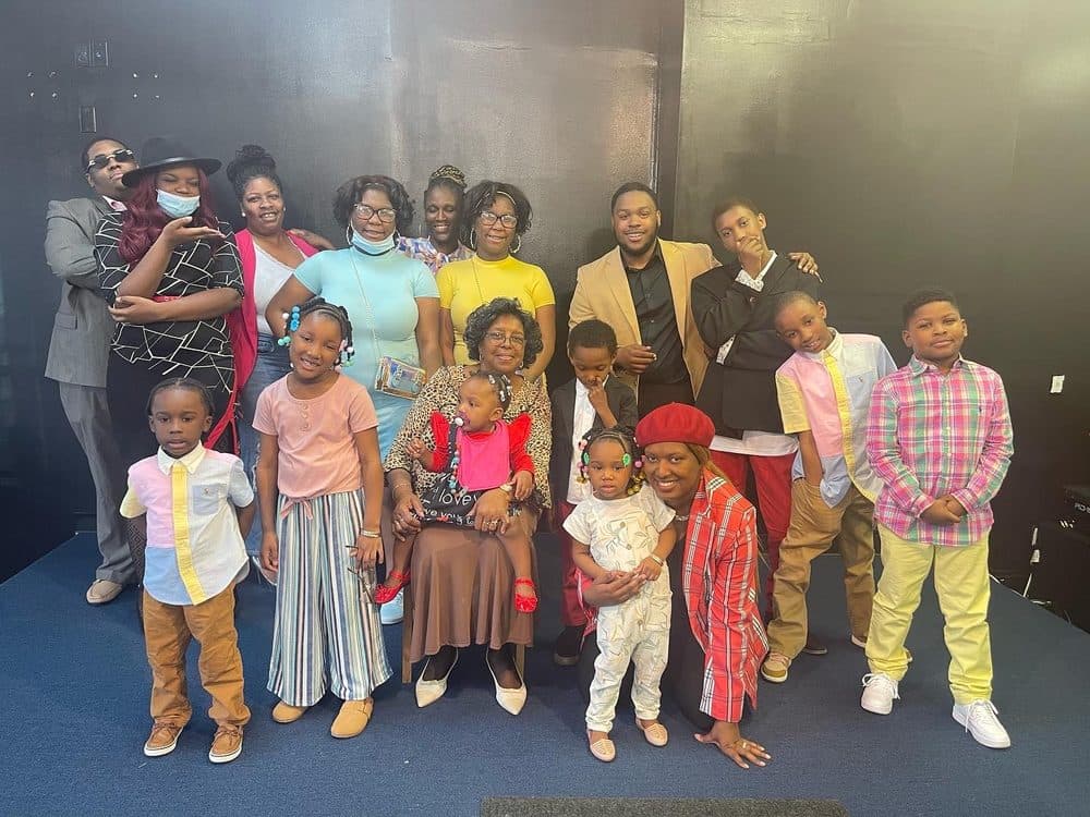 A multigenerational church family posing together, smiling